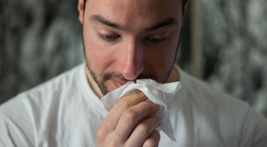 man with tissue