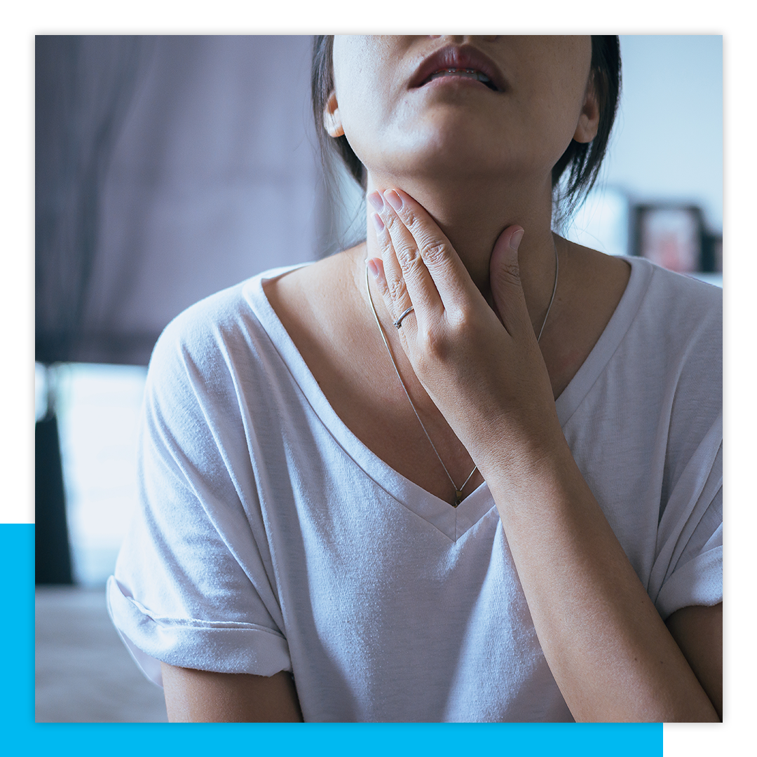woman with throat pain