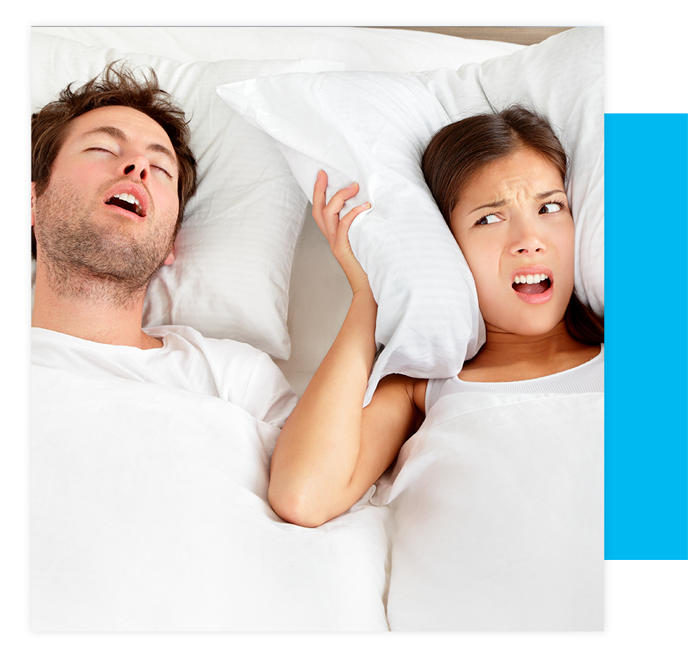 person suffering from sleep apnea partner snoring woman with pillow over her head
