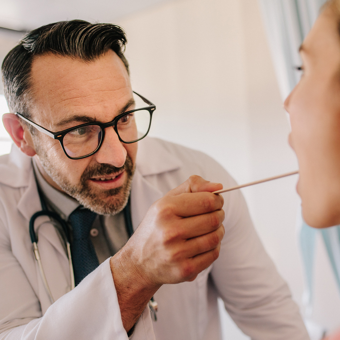 Doctor performing an exam on a patient.