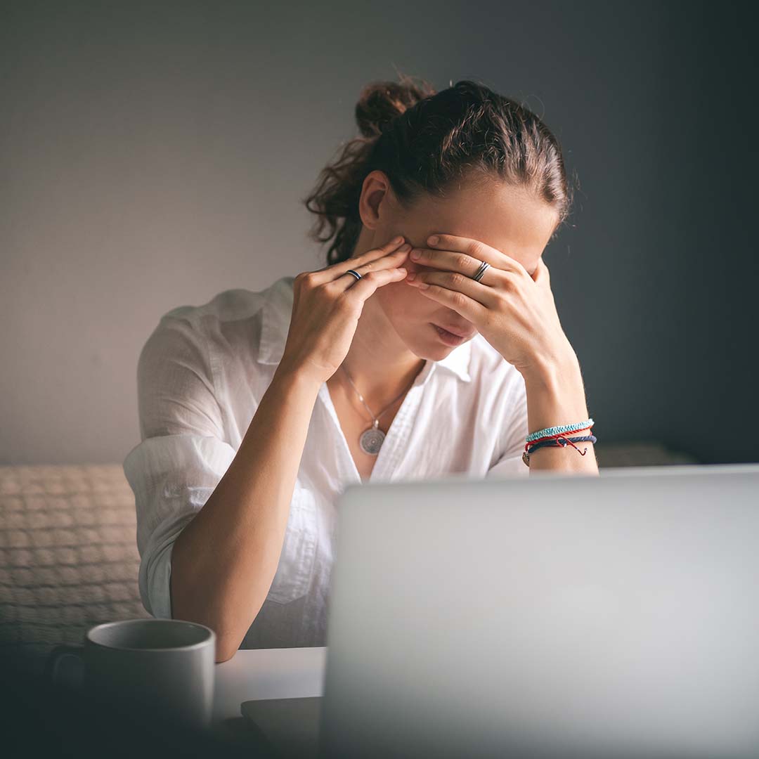Woman suffering from tinnitus