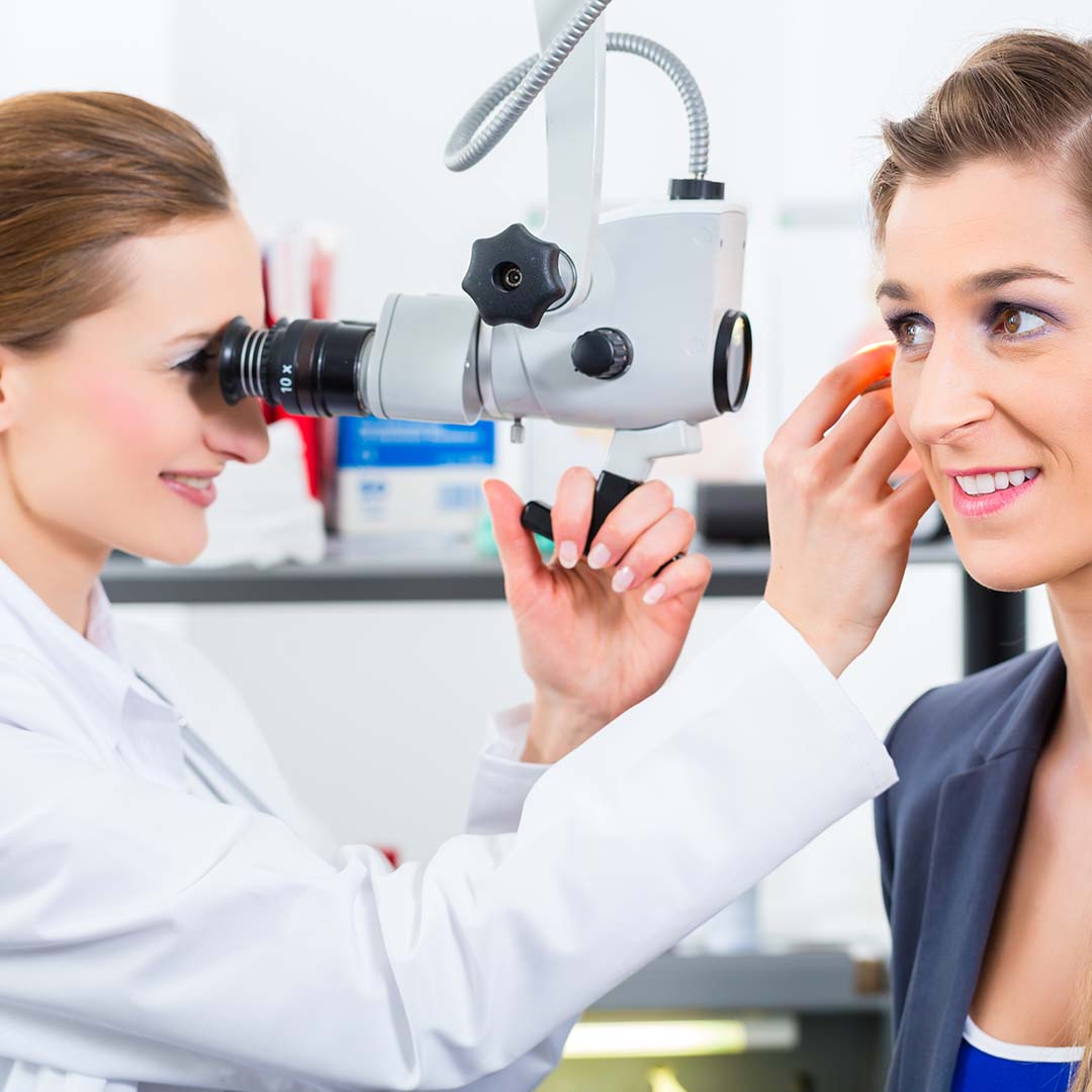 WOman getting checked out for ear disease