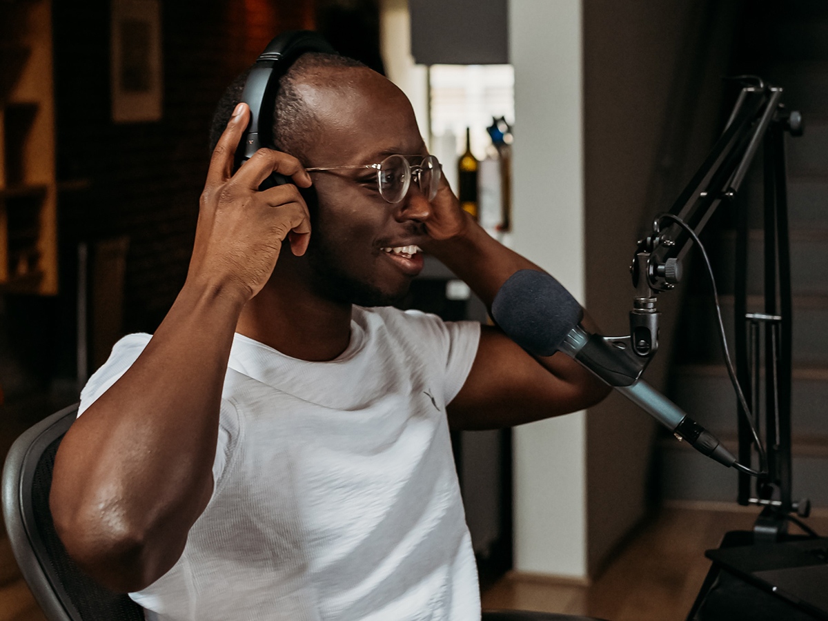 Handsome man preparing to record podcast