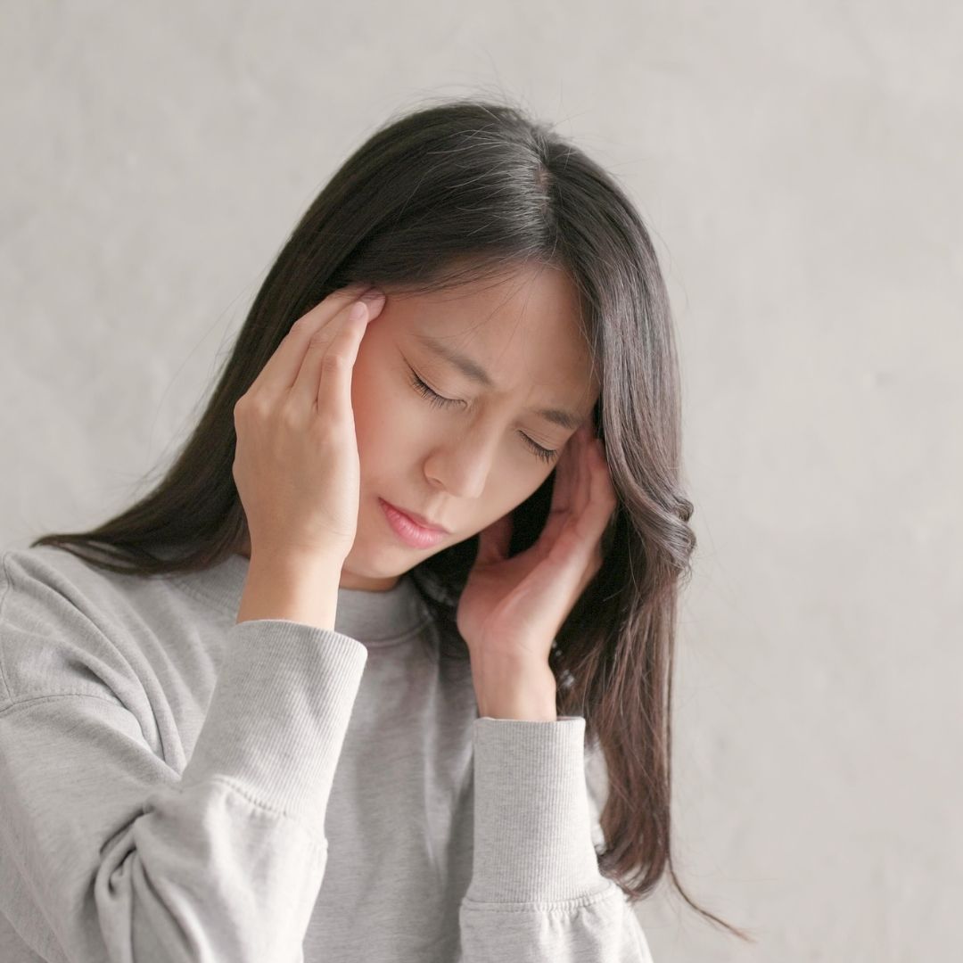 Woman experiencing vertigo