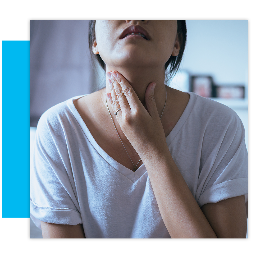 Woman touching throat