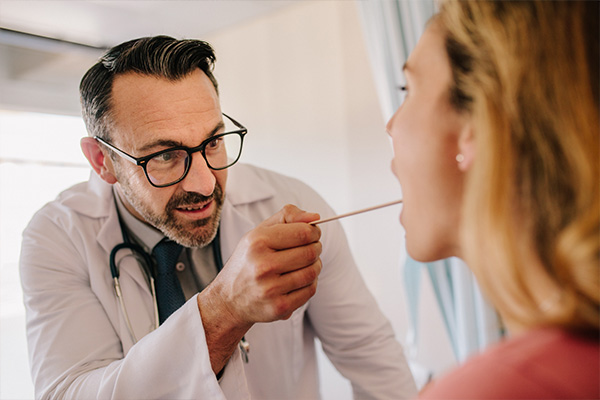 ENT doctor examining patient