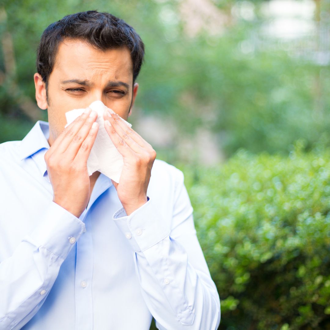blowing nose outdoors