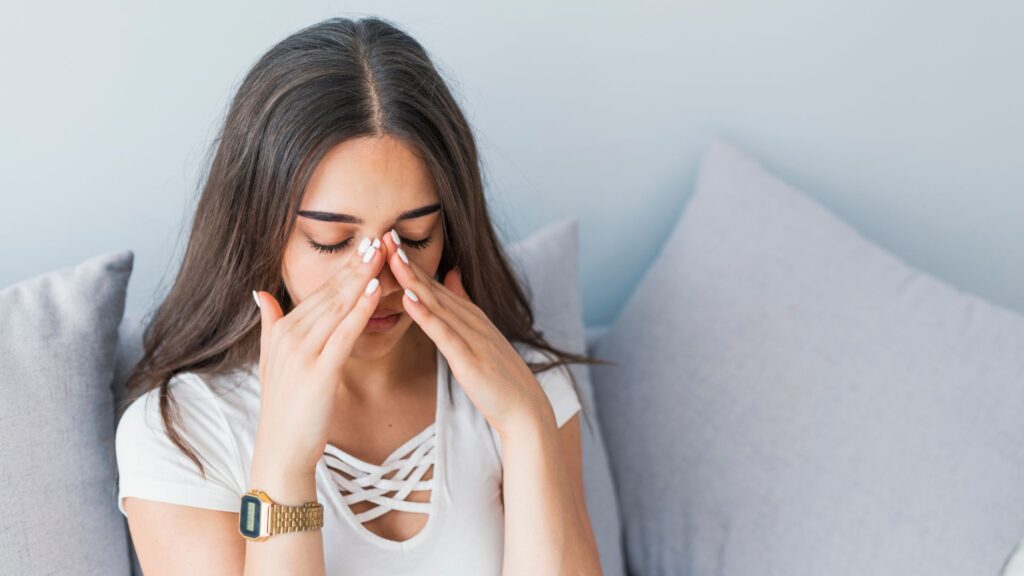 woman suffering from sinus pressure