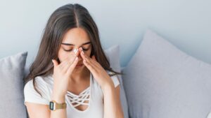woman suffering from sinus pressure