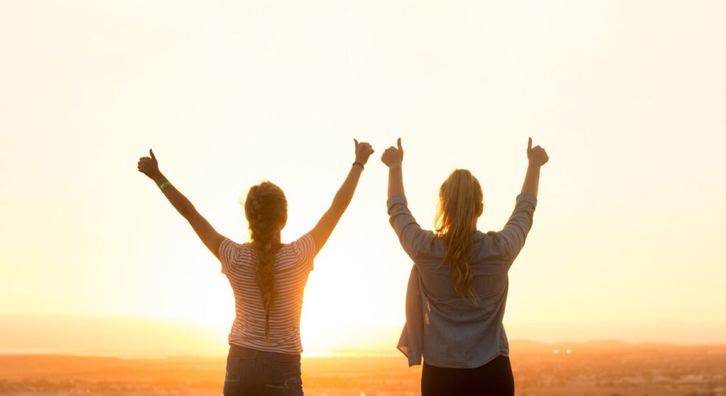 Happy people with sunset background