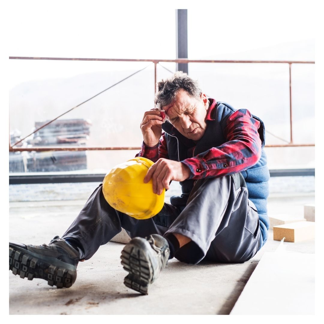 man at work site with head injury