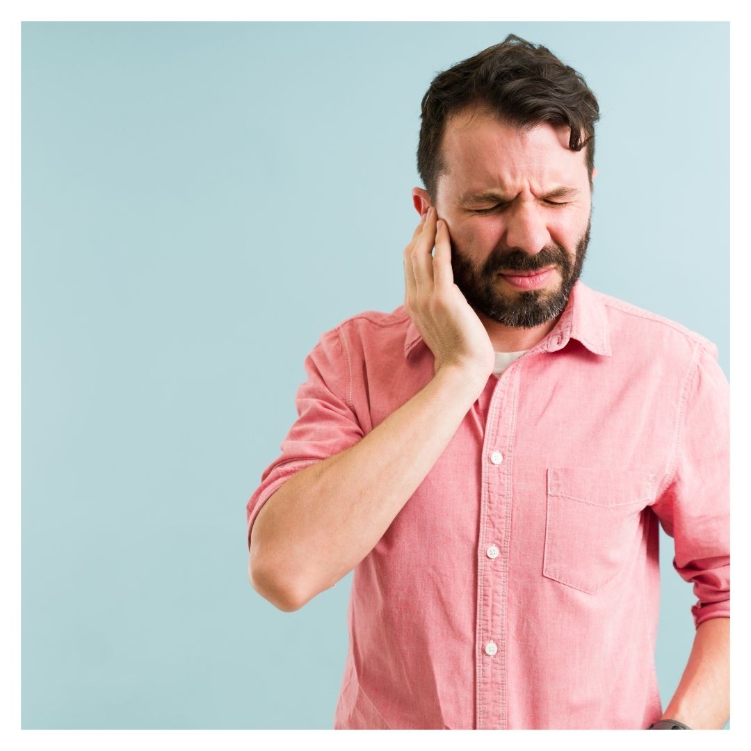 man with ear ringing