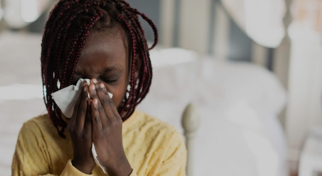 sneezing woman