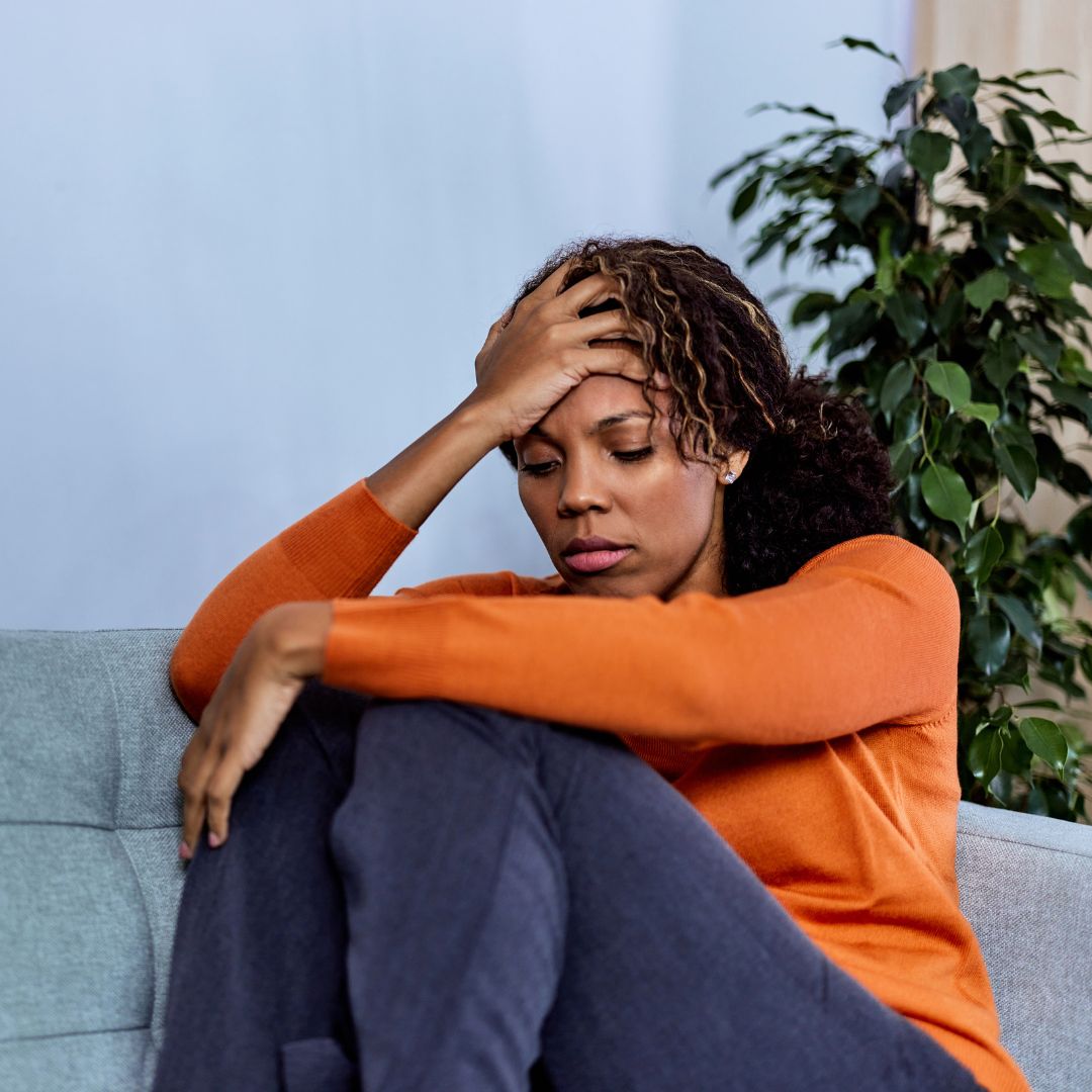 a woman holding her head