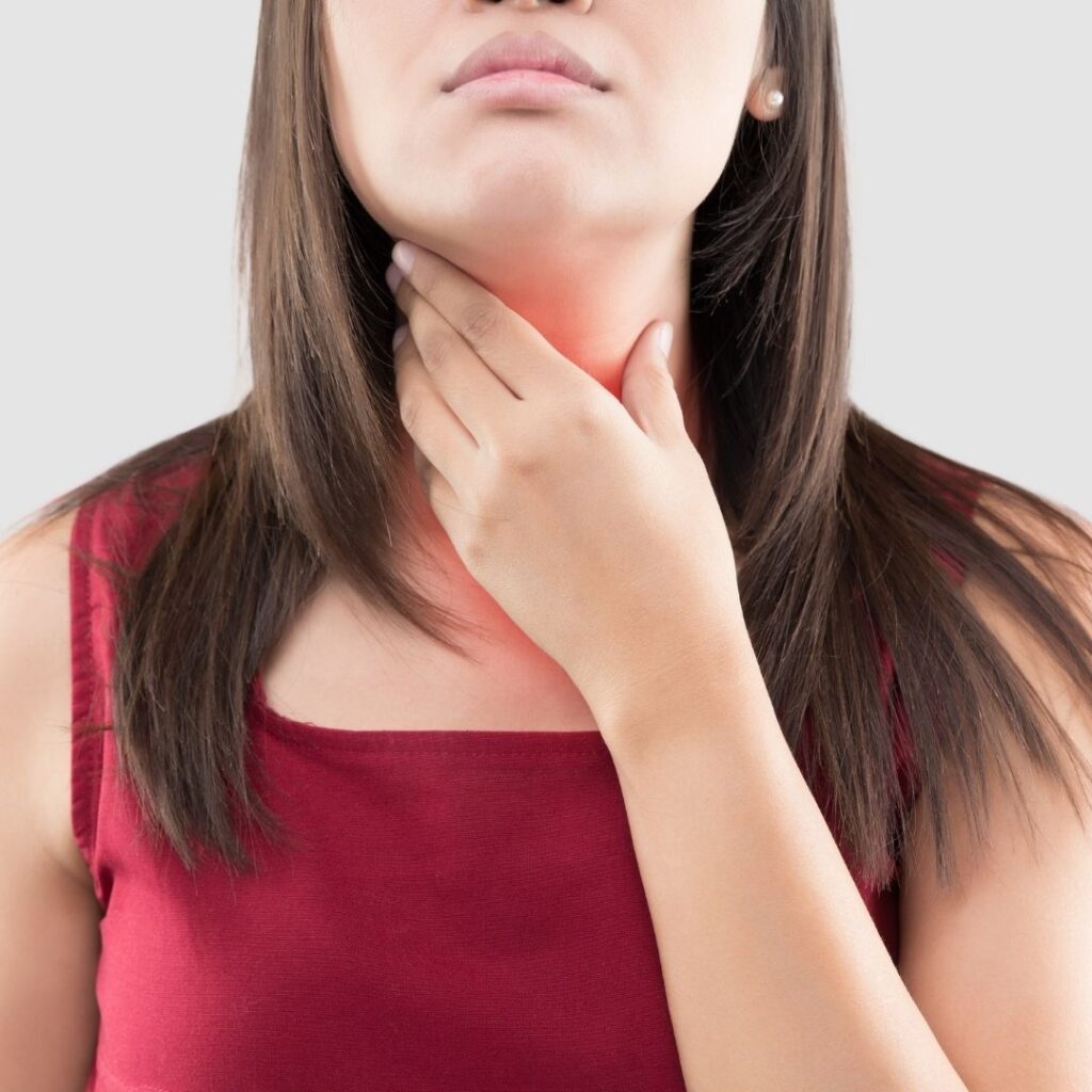 woman with a sore throat from snoring